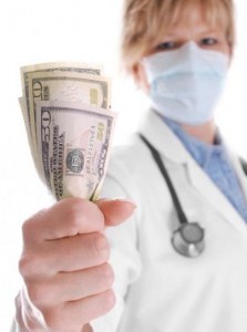 Doctor Holding Money with Focus on Money
