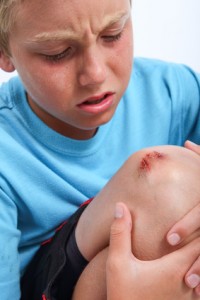 Boy with scraped knee